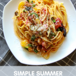 a plate of summer spaghetti on a gingham tablecloth