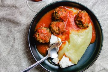 Turkey and spinach meatballs in tomato sauce with mashed potatoes and feta cheese