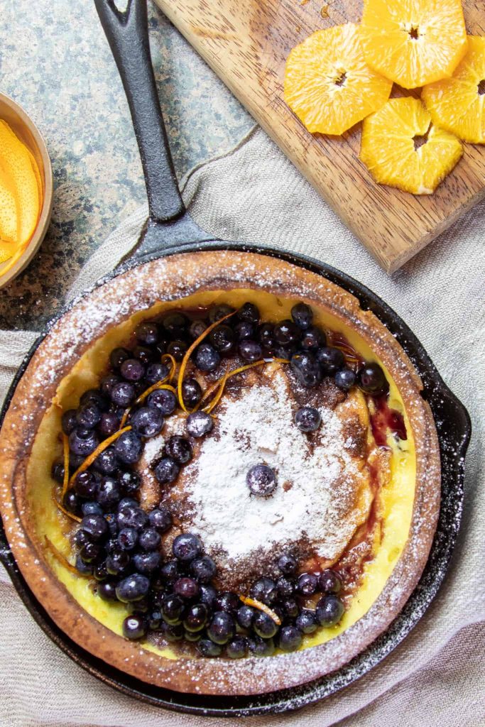 dutch-baby-pancake-with-blueberries-in-a-cast-iron-pan