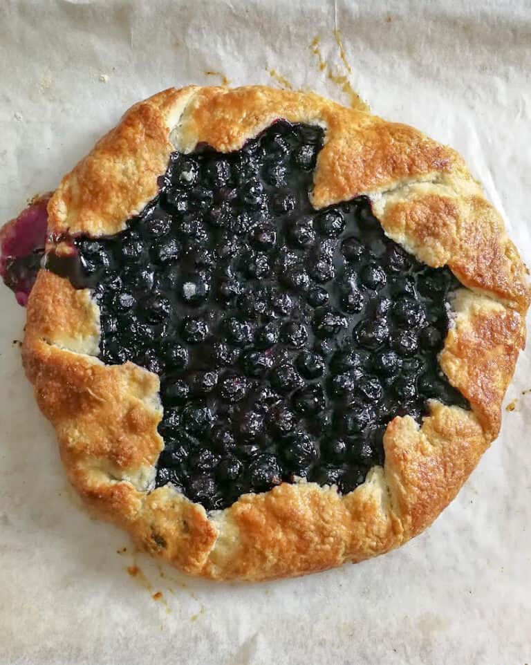 summer fruit galette on a baking sheet.
