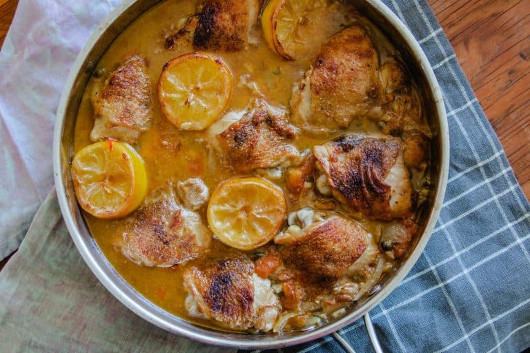 Oven braised chicken thighs with lemons and capers.