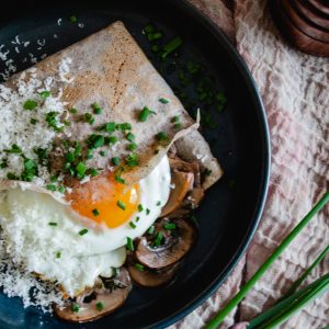 Savoury buckwheat crepes with creamy mushrooms and a fried egg