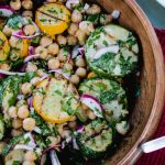 zucchini and chickpea salad in a wooden bowl.