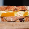 baked omelette sandwich on rustic olive bread