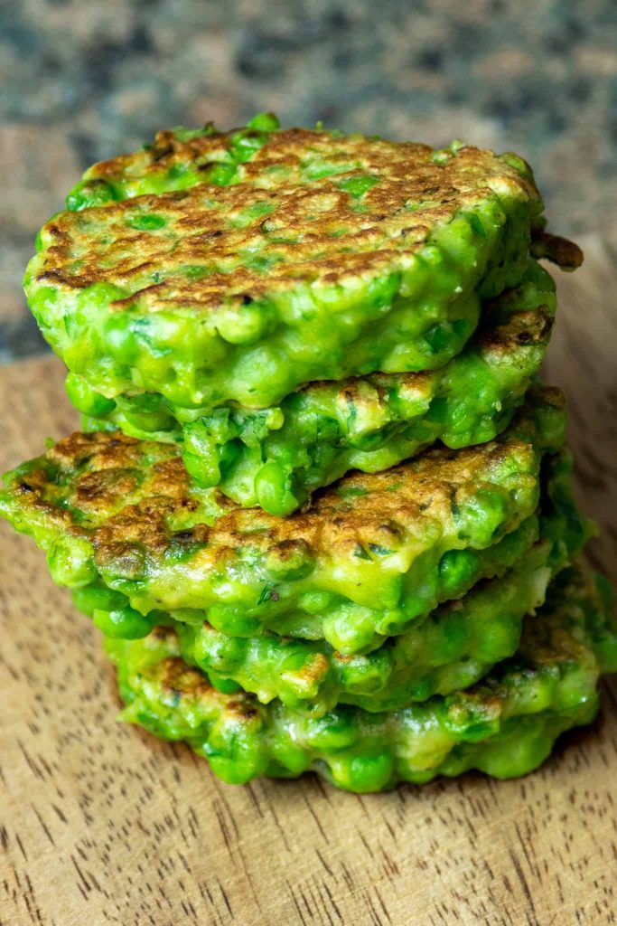 a stack of green pea fritters