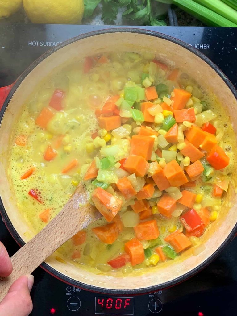 coconut corn chowder cooking in a pot