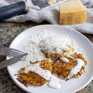 rutabaga latkes with parmesan cheese on a plate