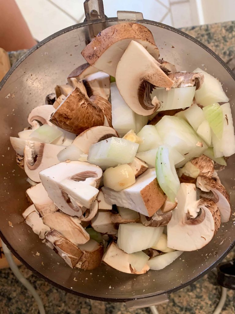 mushrooms, walnuts, and onions in a food processor.