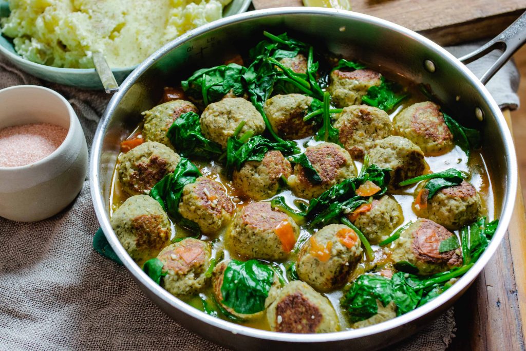 brothy meatballs with spinach.