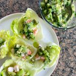 lettuce cups filled with poached prawns and kiwi salsa.