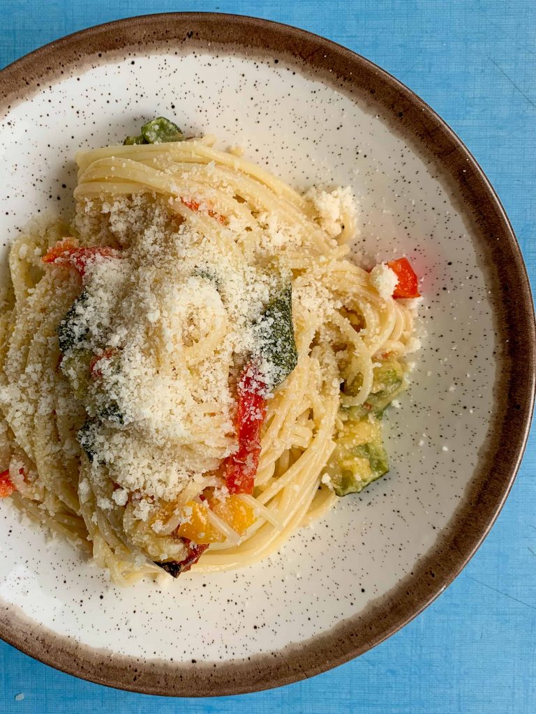 zucchini pasta sauce on spaghetti with parmesan cheese.