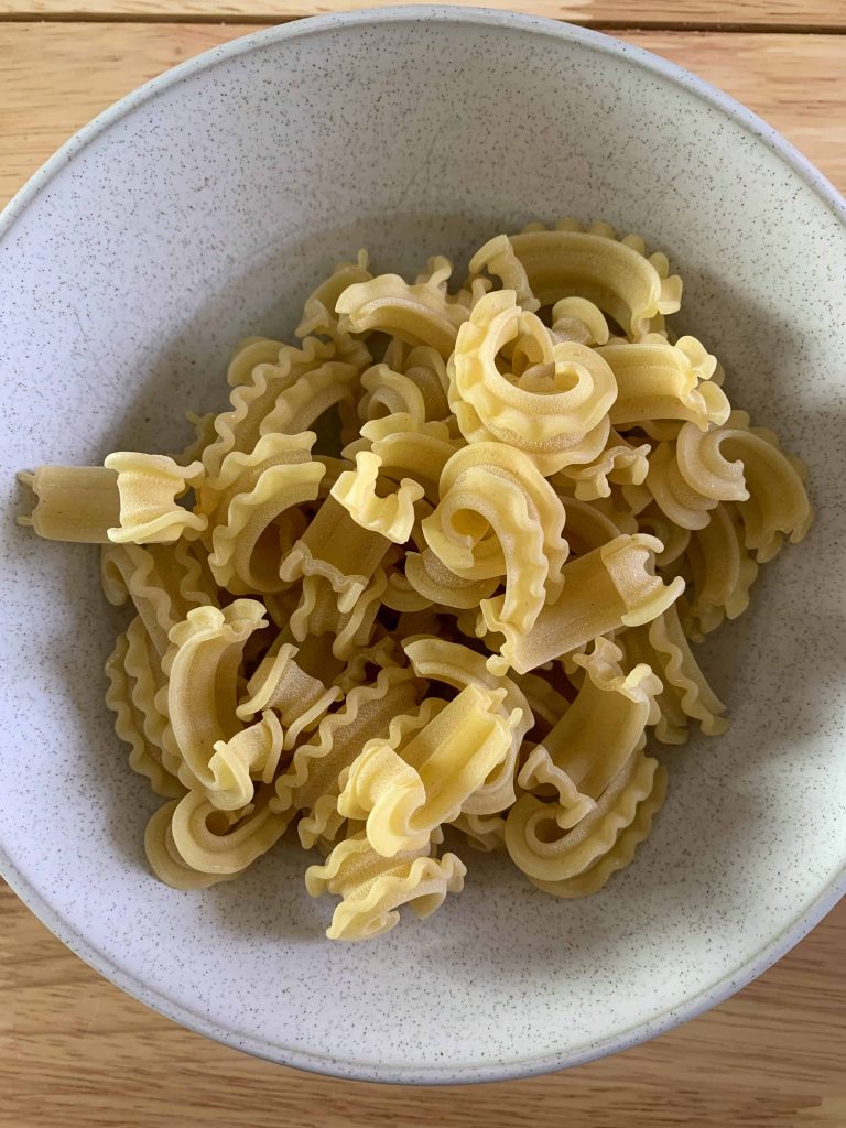 a bowl of dried cascatelli pasta