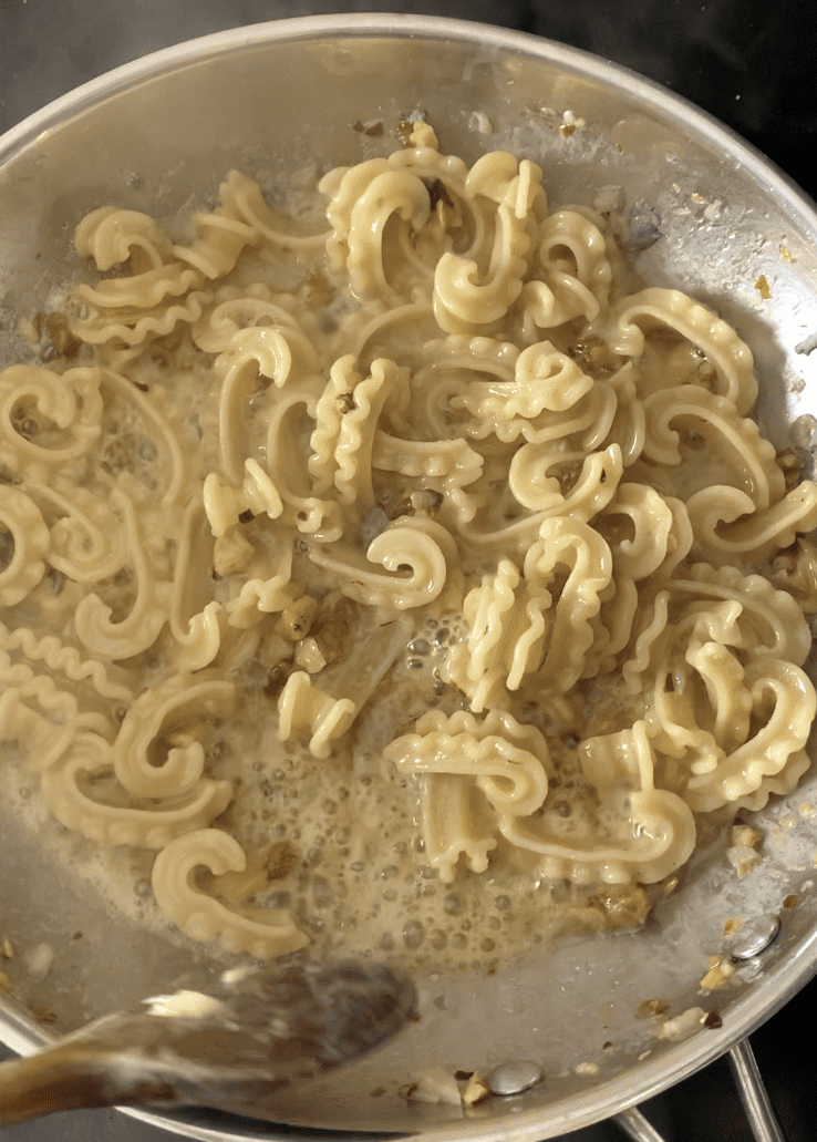 A pan of blue cheese pasta, simmering.