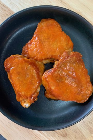 a plate of buffalo chicken thighs.