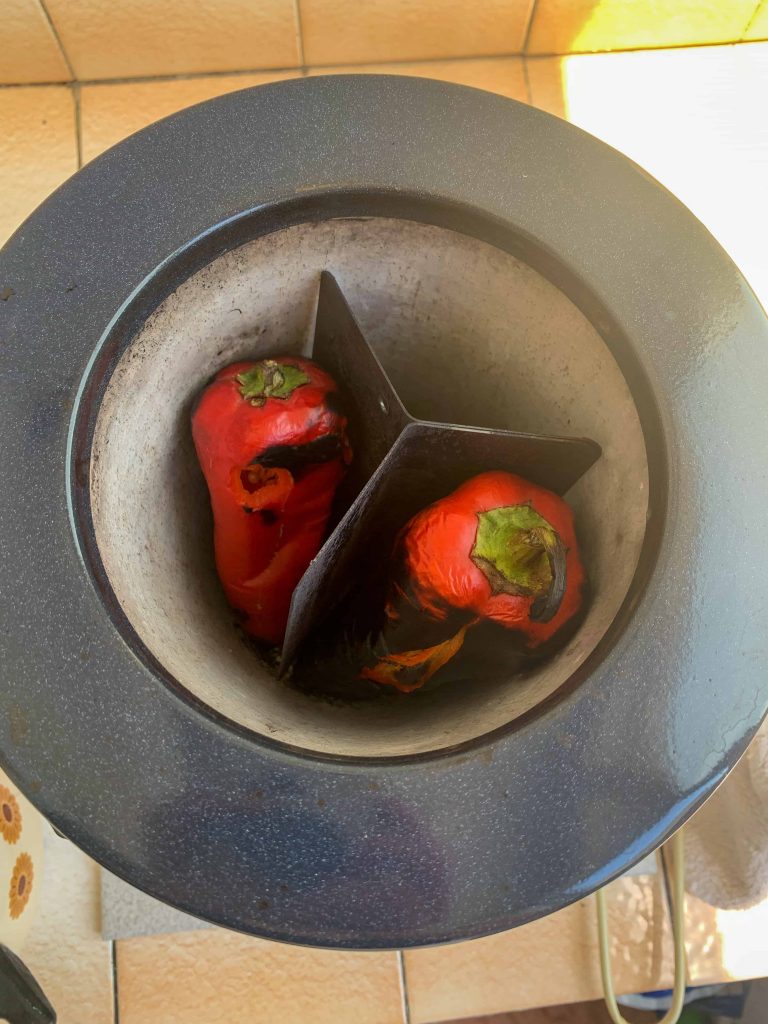 red peppers roasting in a Bulgarian pepper roaster.