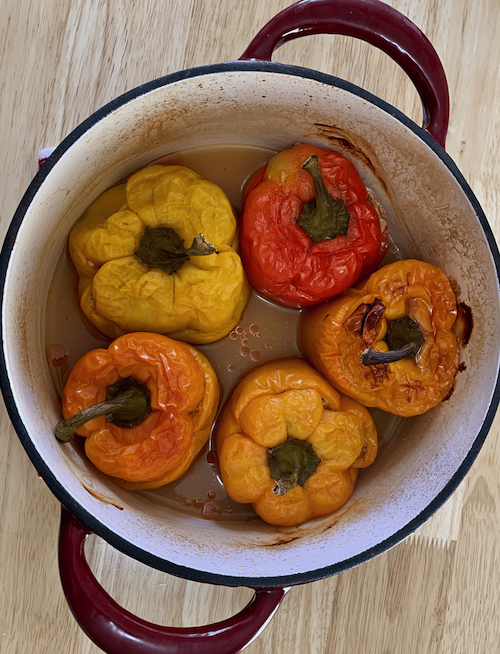 cooked stuffed peppers in a dutch oven.