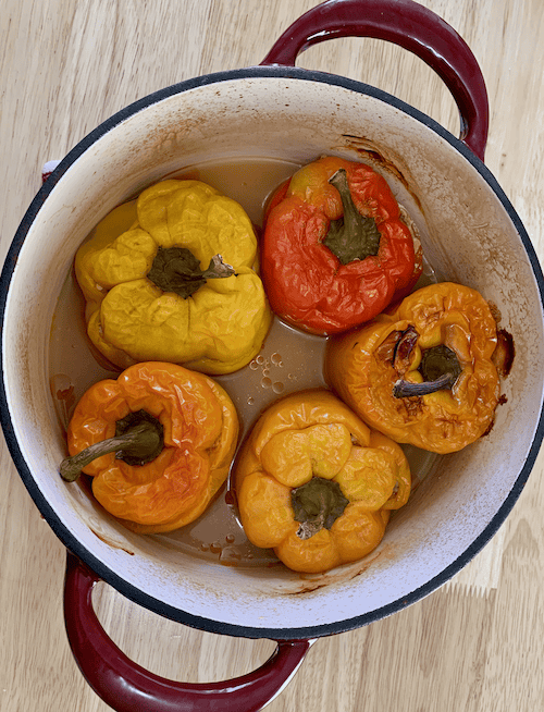 cooked stuffed peppers in a dutch oven.