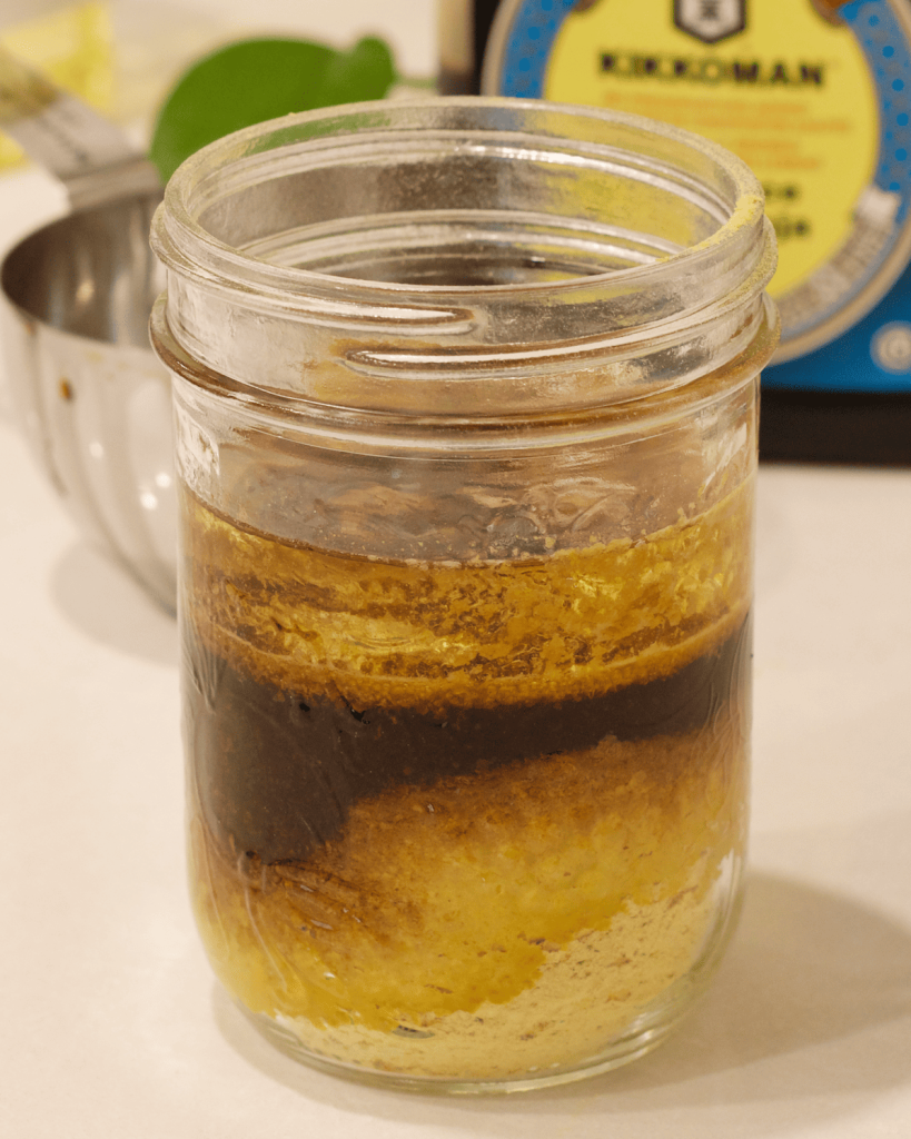nutritional yeast dressing in a jar, ready to blend.