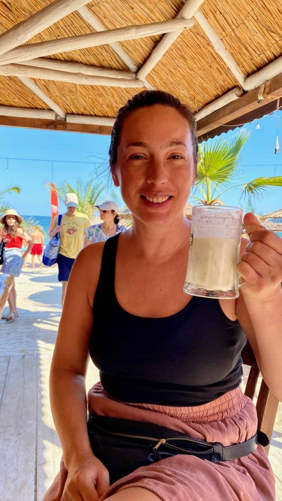 Woman holding a pint of Tarator at a bar in Varna, Bulgaria.