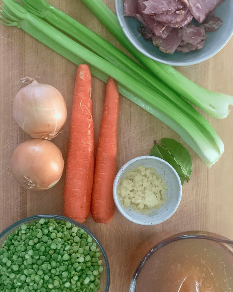 Ingredients for Instant Pot Split Pea Soup displayed on a cutting board.