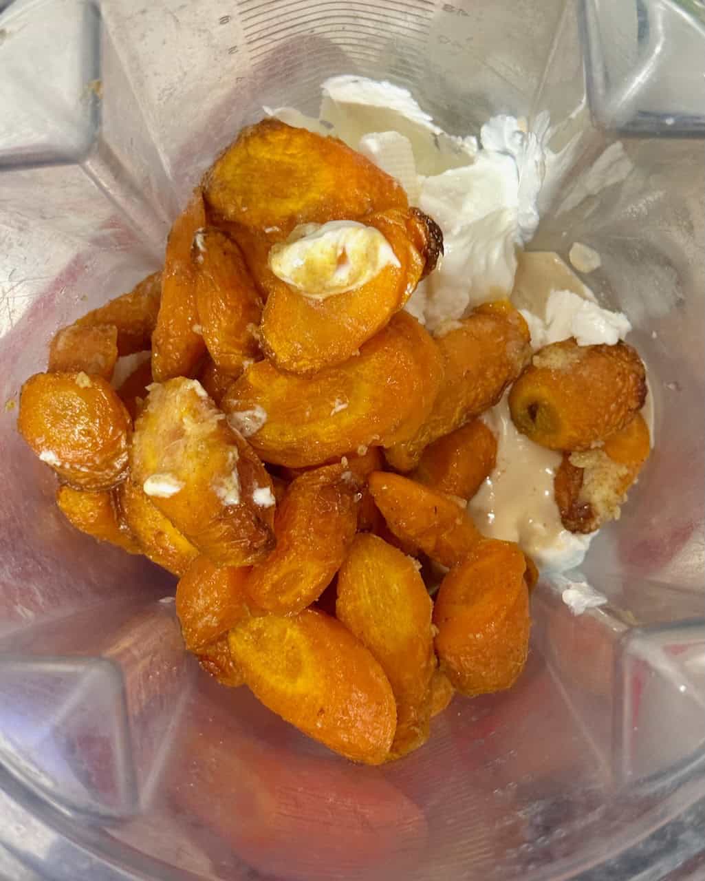 Roasted carrots combined with yogurt, feta and tahini in a blender.