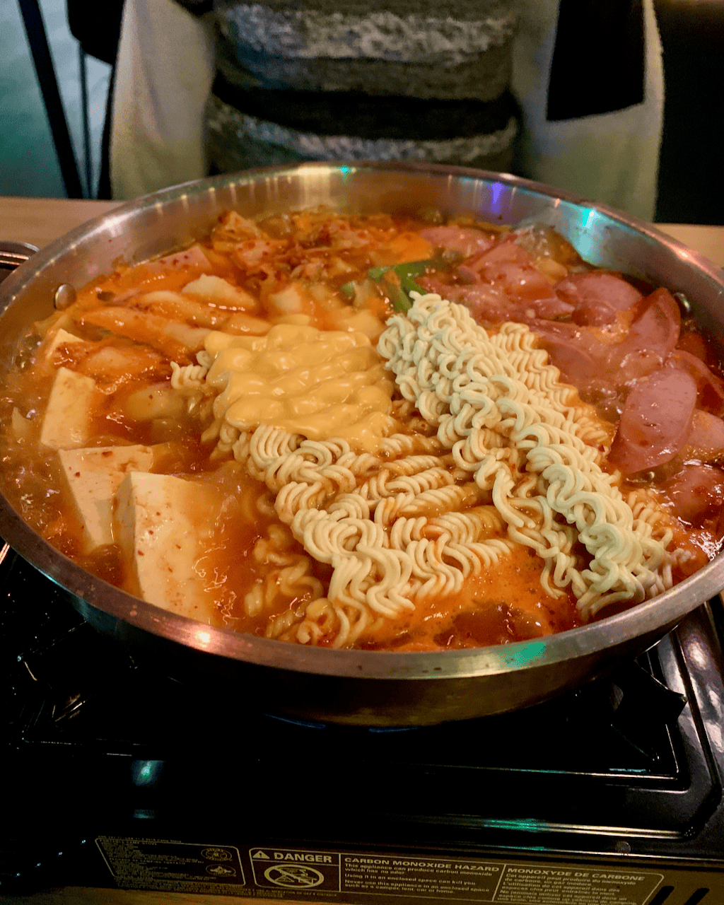 A large pot of army stew cooking.