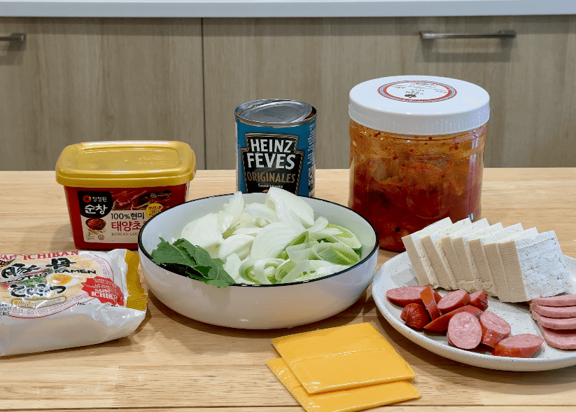 Quick Korean Army Stew (Budae Jjigae) ingredients for a 10-minute meal.