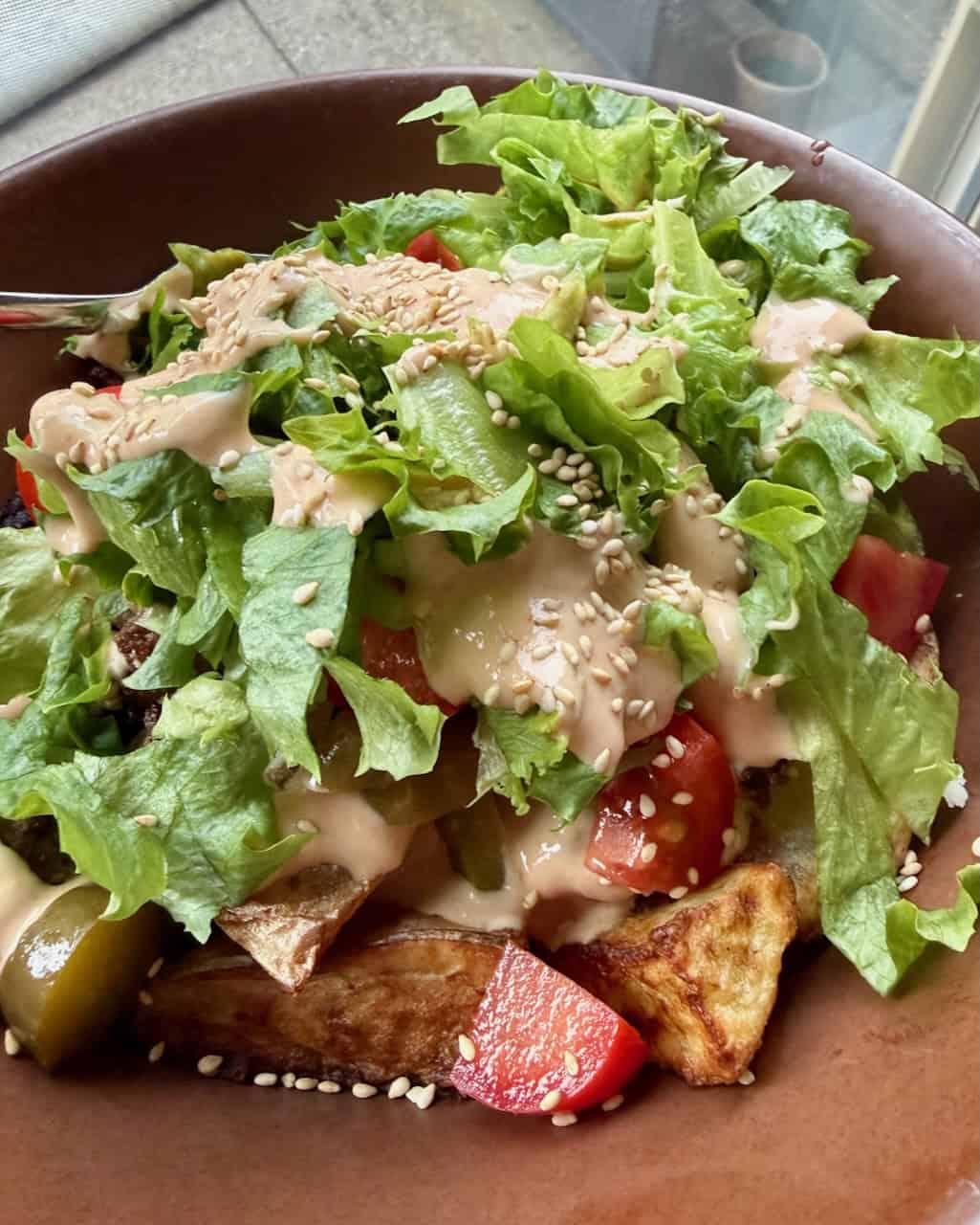 A burger bowl with lots of crunchy lettuce.
