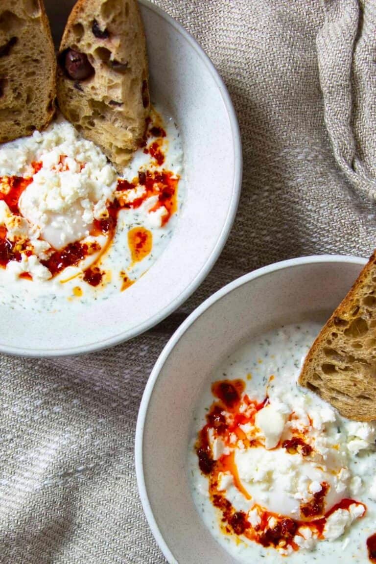 two bowls of eggs panagyurski with bread.
