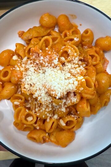 Overhead image of a bowl of kimchi carbonara pasta.
