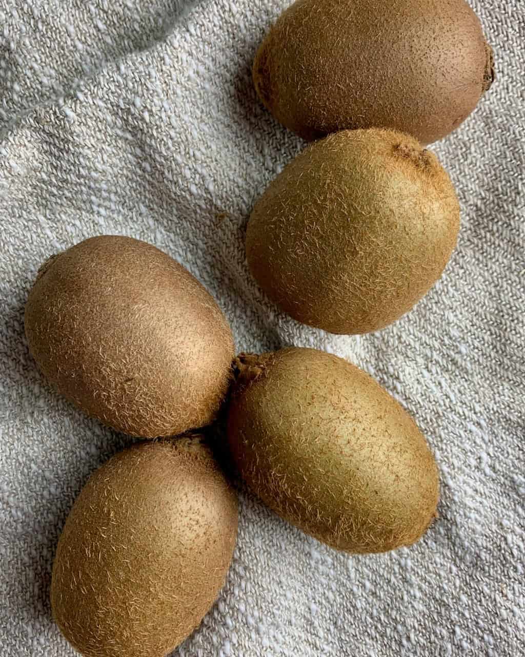 fresh kiwis ready to be prepared.