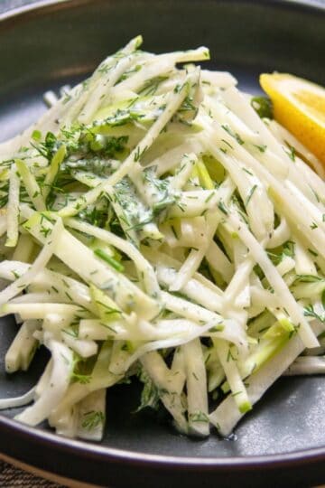 Kohlrabi Salad With Apple And Dill on a plate.