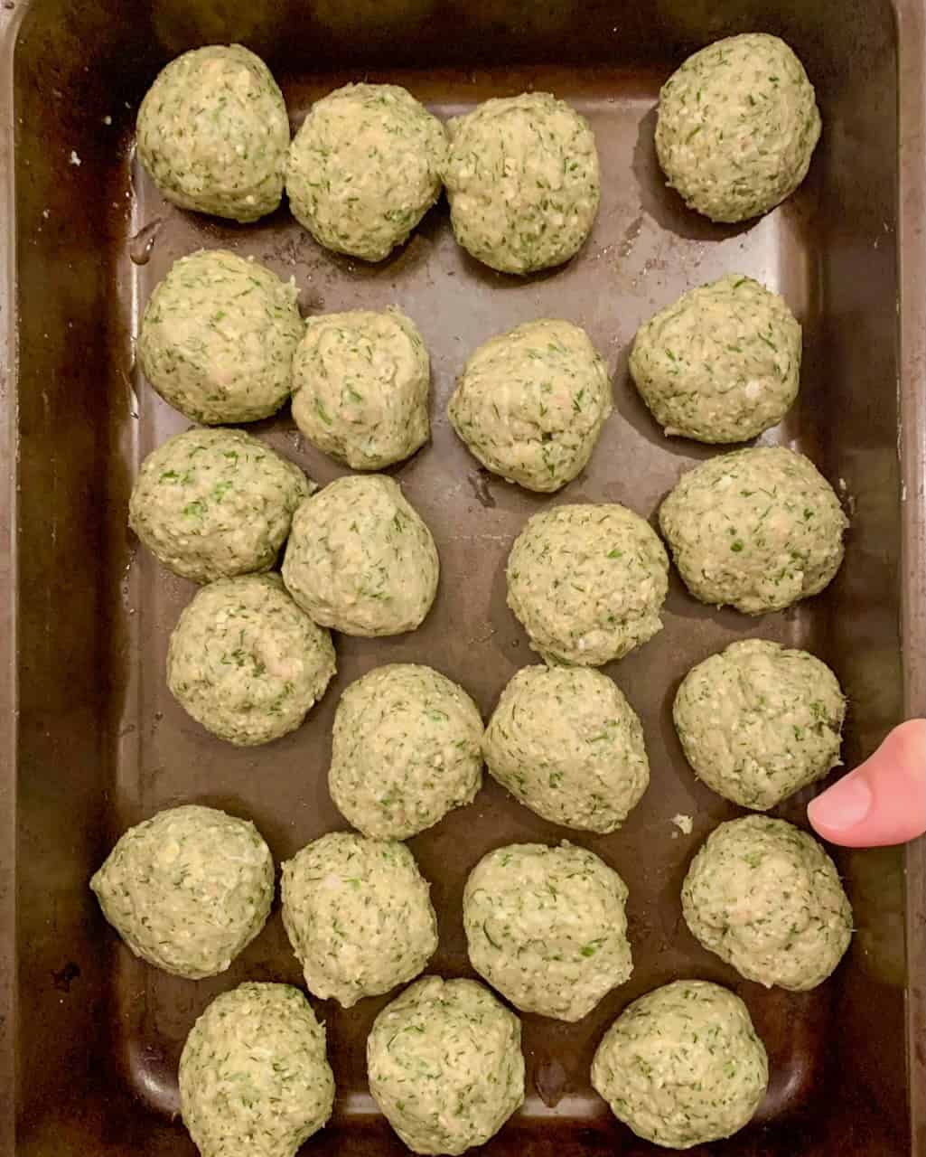 Rolled turkey meatballs ready to be chilled.