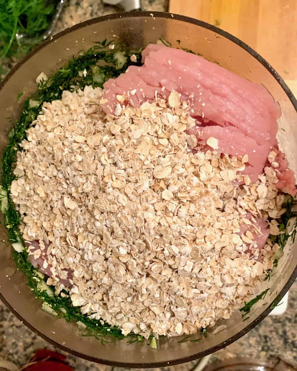 Meatball ingredients in a food processor.