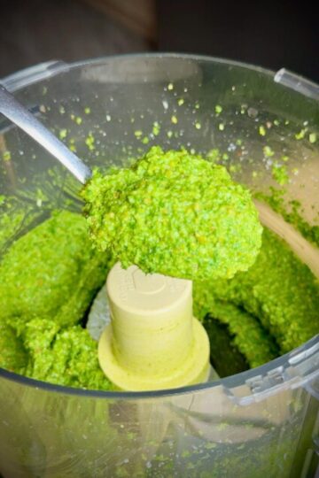 A spoonful of vibrant radish greens pesto straight from the food processor.