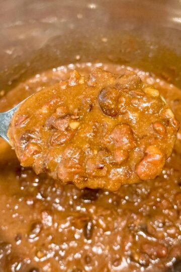 Big spoonful of refried beans.