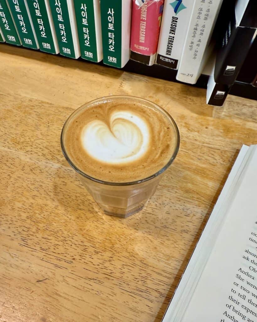 A beautiful flat white coffee in a coffee shop.