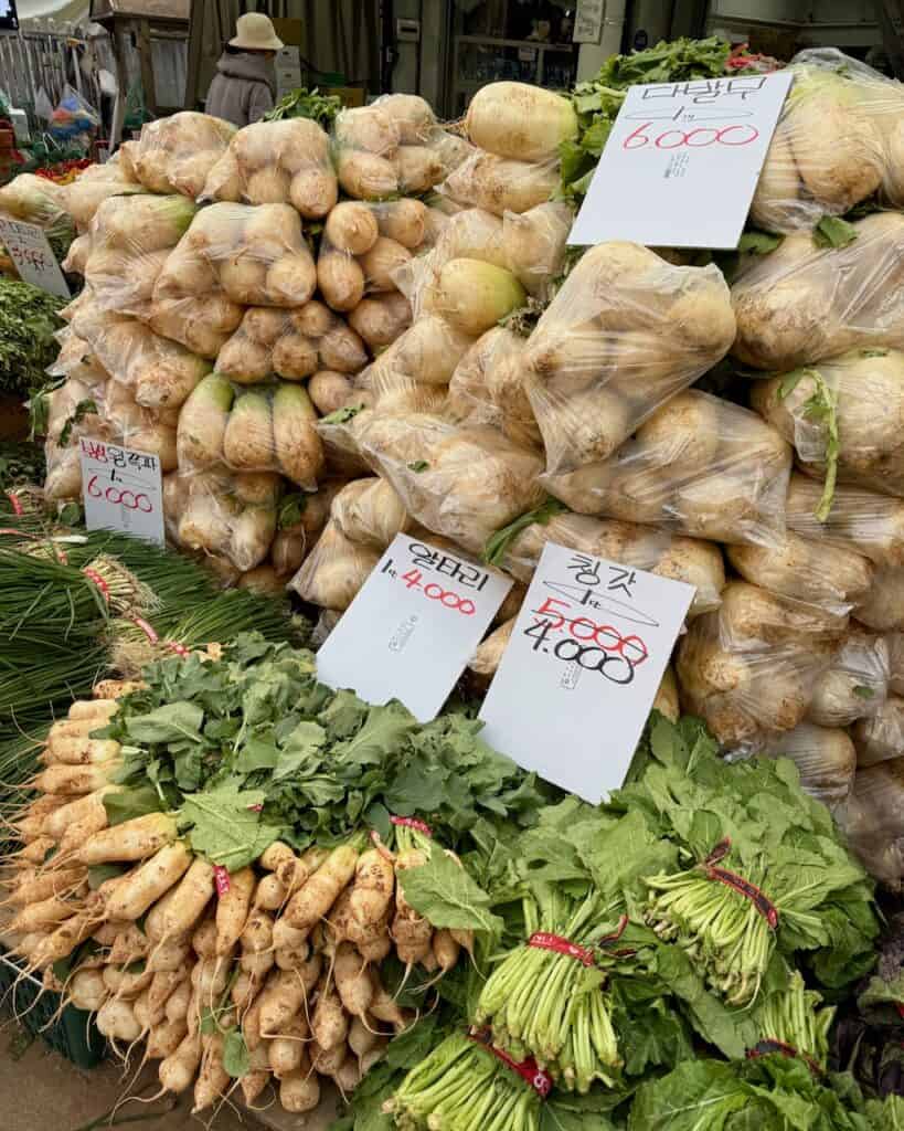 Radishes piled high at a market for kimchi making season.