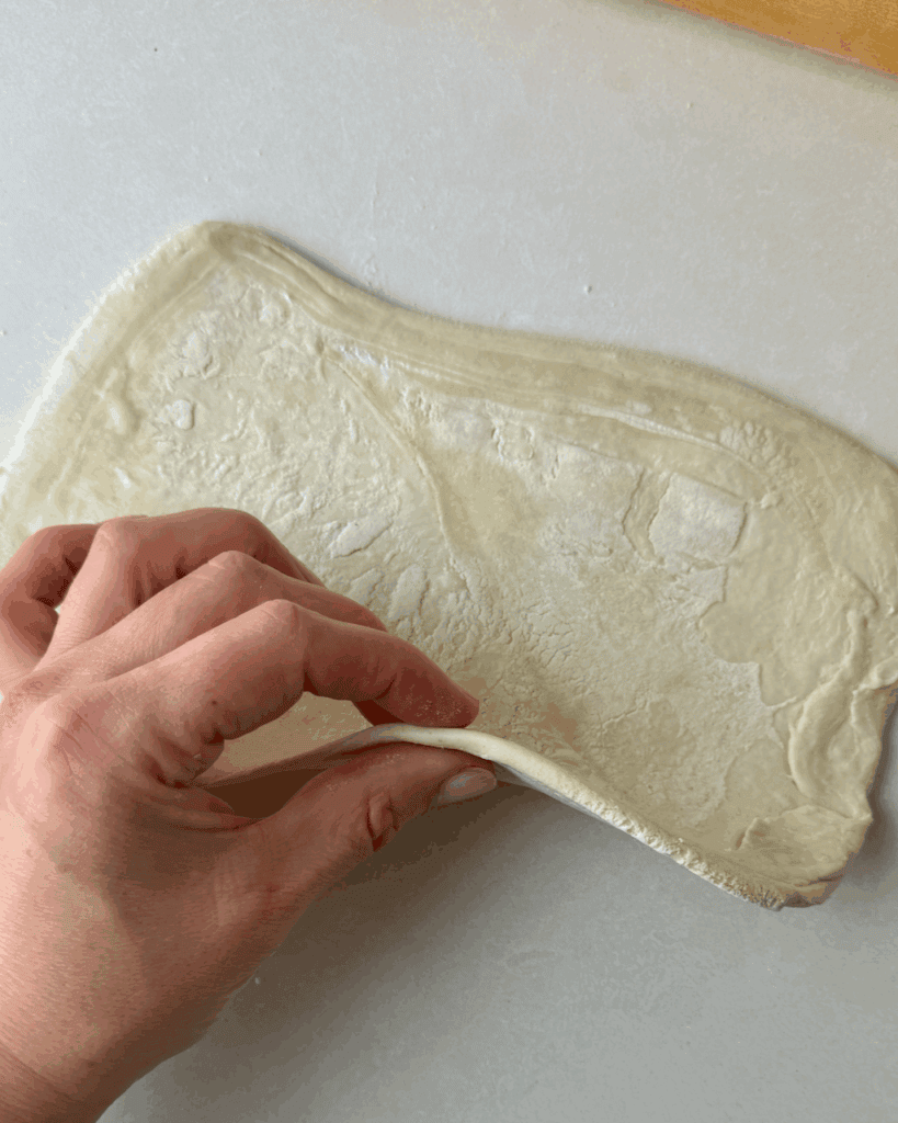 A sheet of puff pastry rolled into a rectangle.