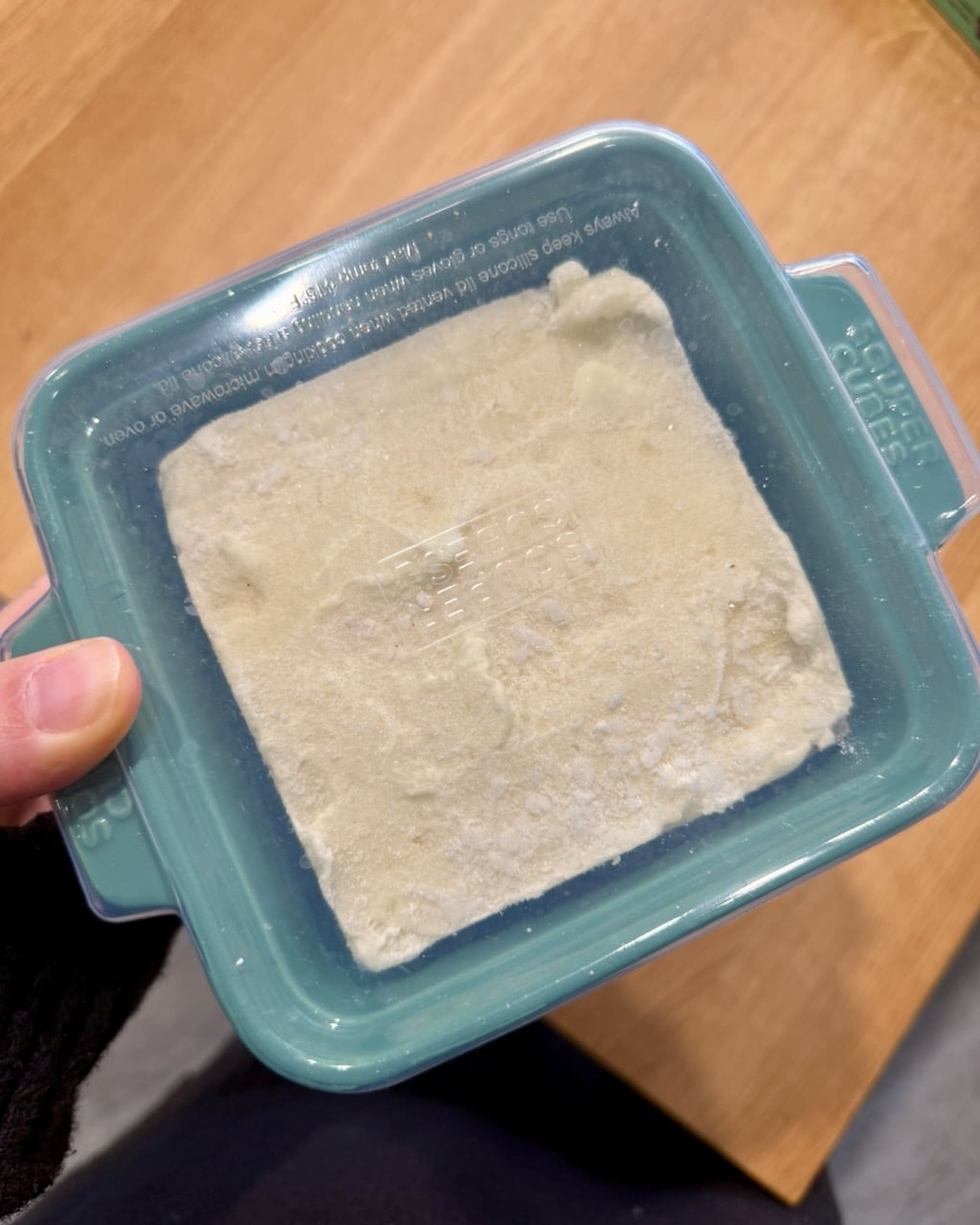 A frozen (unbaked) portion of turkey shepherd's pie, ready to defrost and bake.